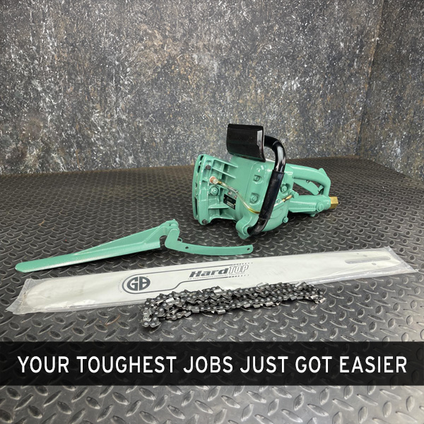 CS Unitec Pneumatic Chainsaw from Obtainium Science and Surplus, displayed on a textured surface with its chain and guide bar detached and placed in front.