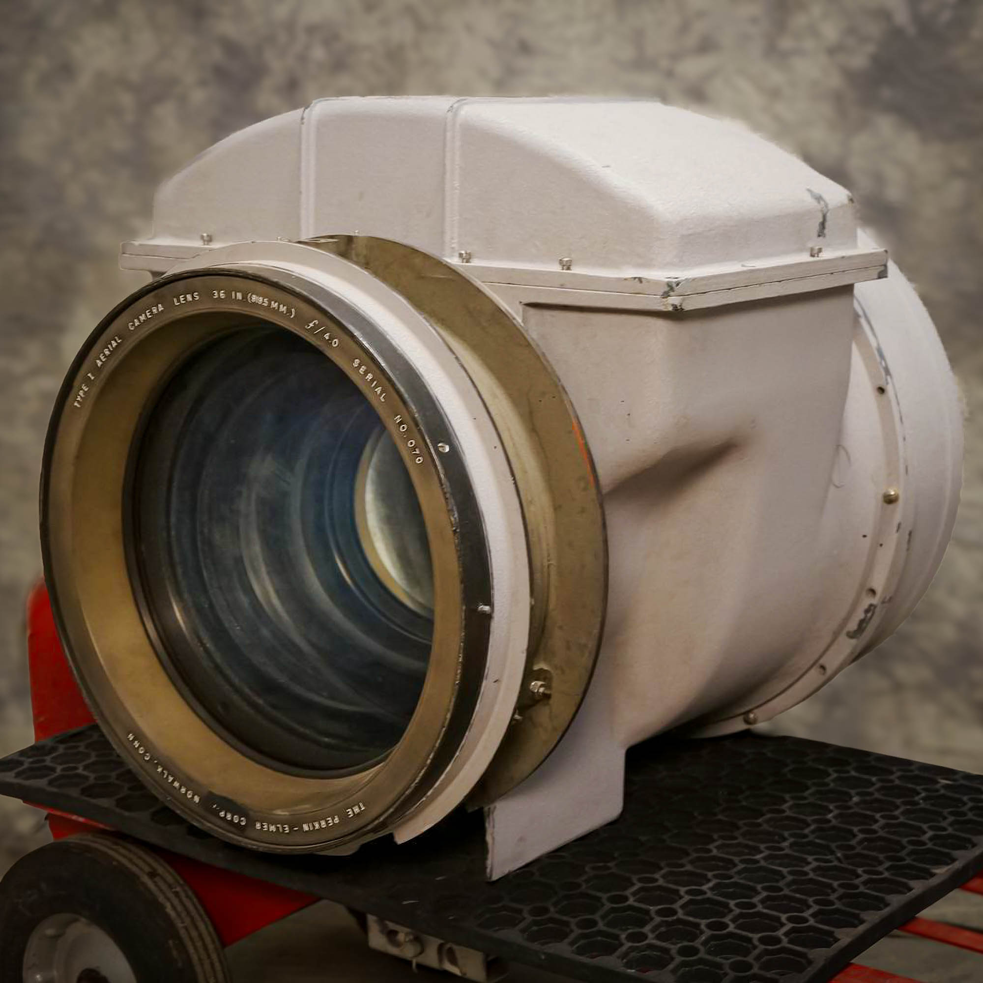 Close-up view of a Cold War Era aerial reconnaissance camera lens, designed for U2 and SR 71 Blackbird spy planes, from Obtainium Science and Surplus, showing the large glass front element.