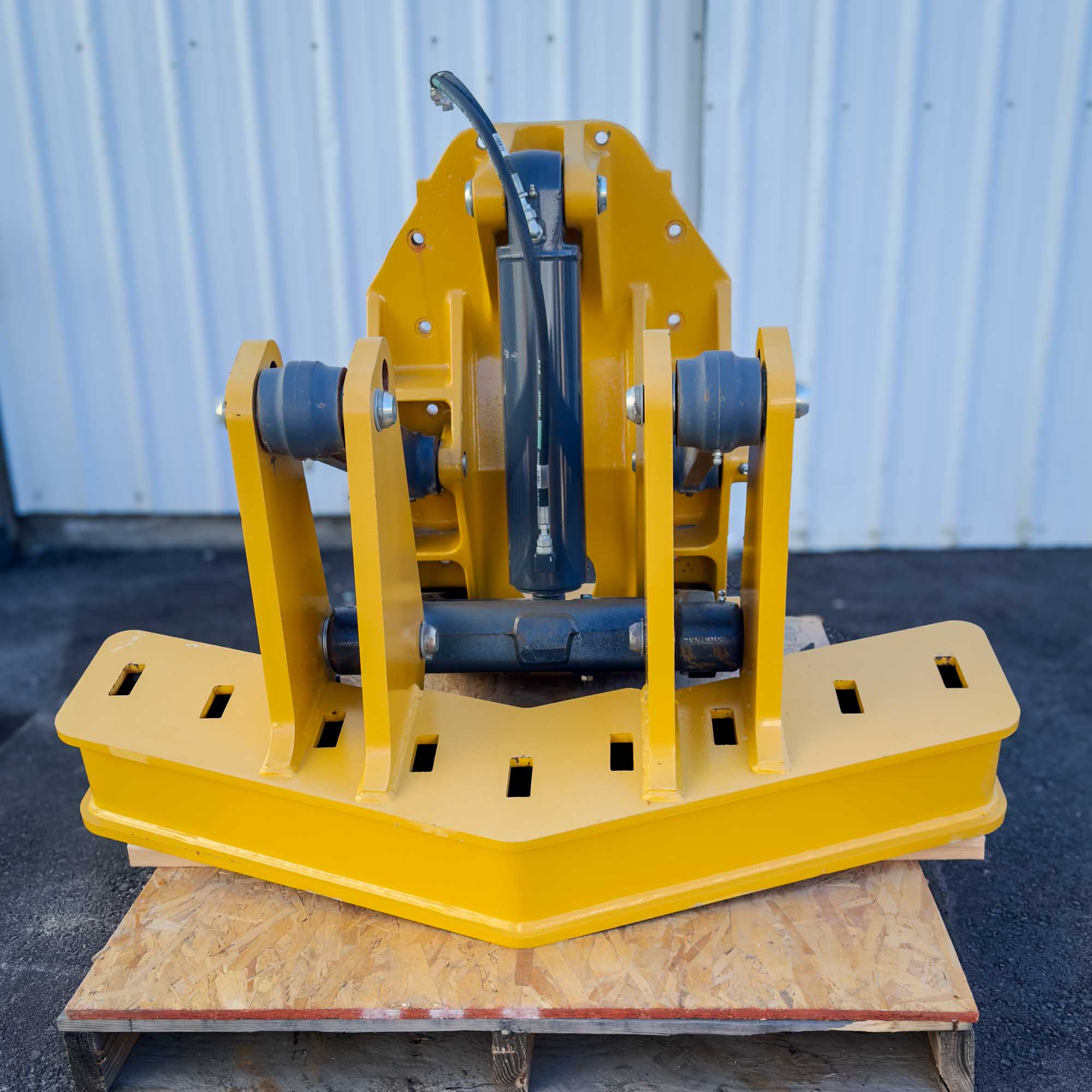 A front view of the yellow Front Mount Scarifier for John Deere Motor Graders from Obtainium Science and Surplus, showcasing its robust frame and steel components.