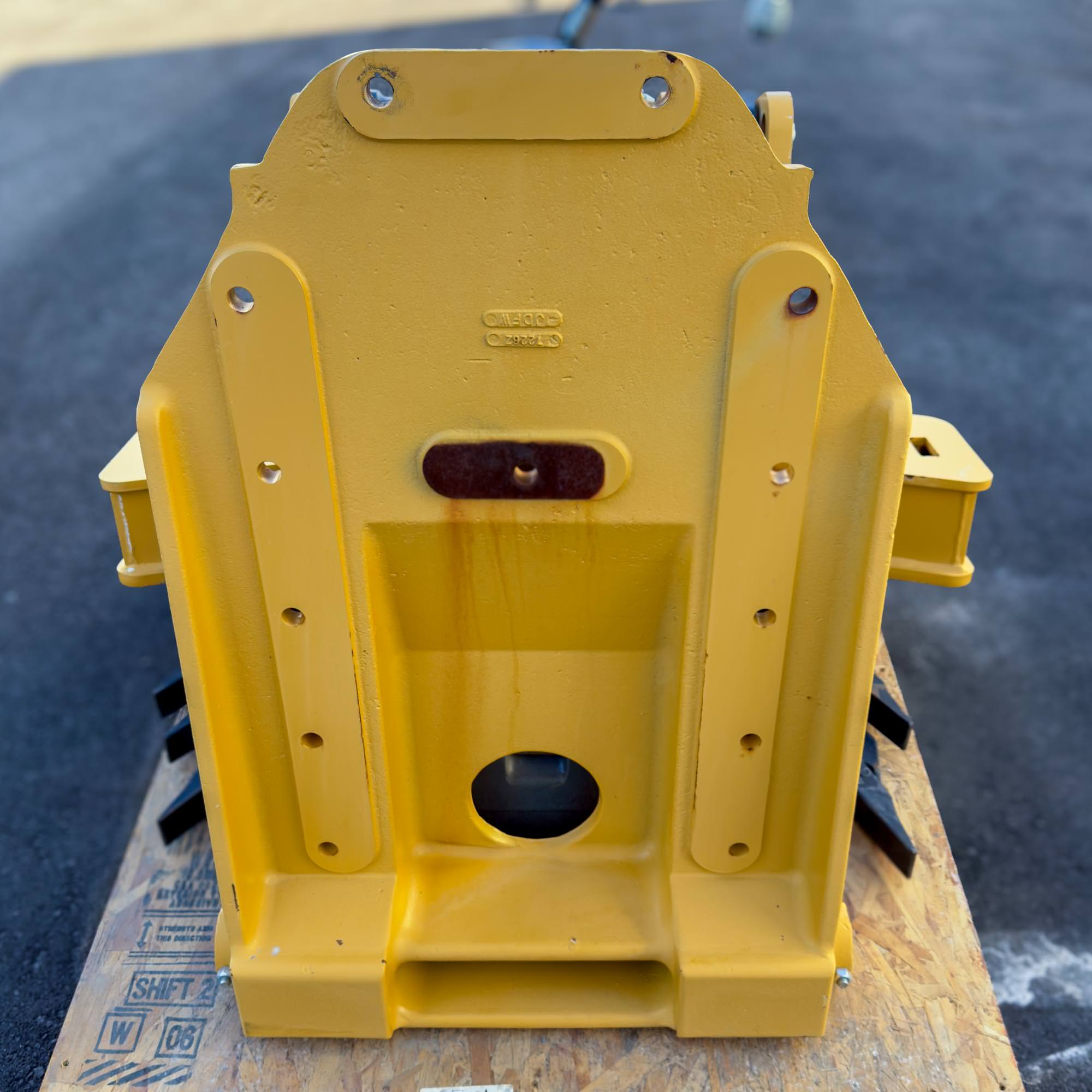 The backside of the yellow Front Mount Scarifier for John Deere Motor Graders from Obtainium Science and Surplus, highlighting its mounting plate and structure.